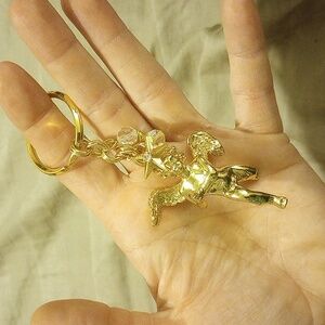 Kirks Folly flying angel, keychain, EUC